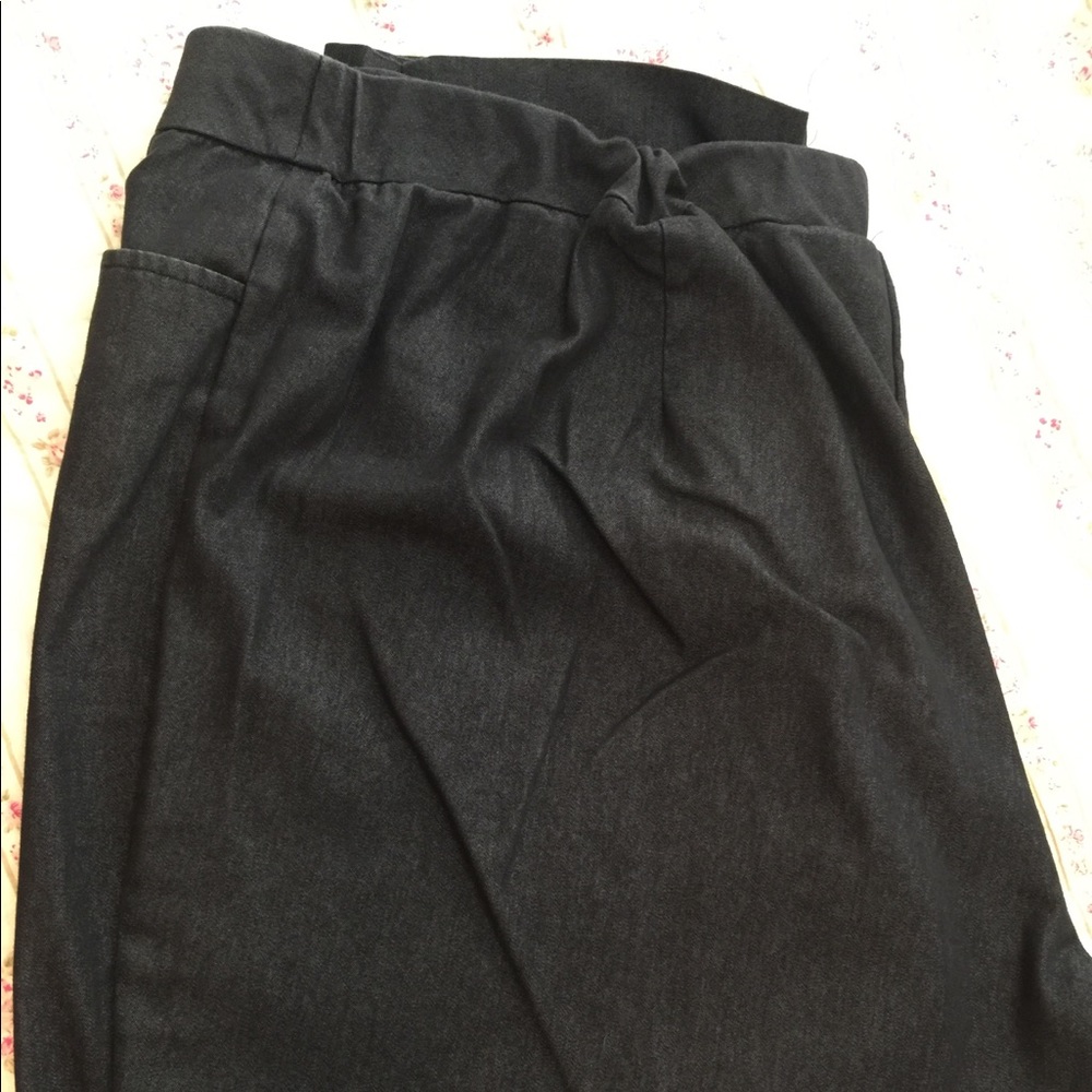Dark dress denim slacks.